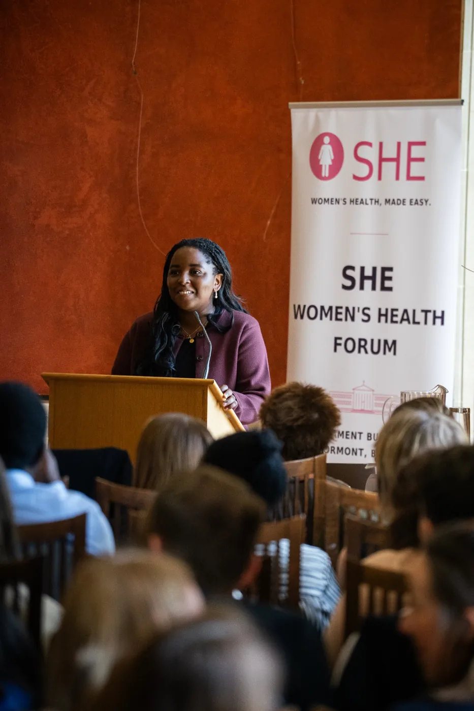 Precious Obasohan speaking at the Forum lectern
