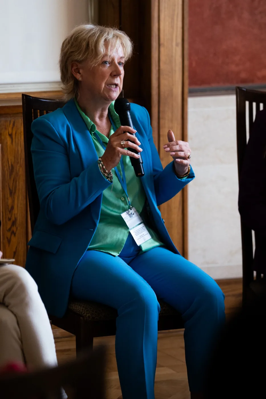 Panel speaker in blue discussing women’s health