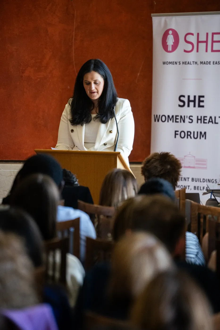 Precious Obasohan speaking at the SHE lectern